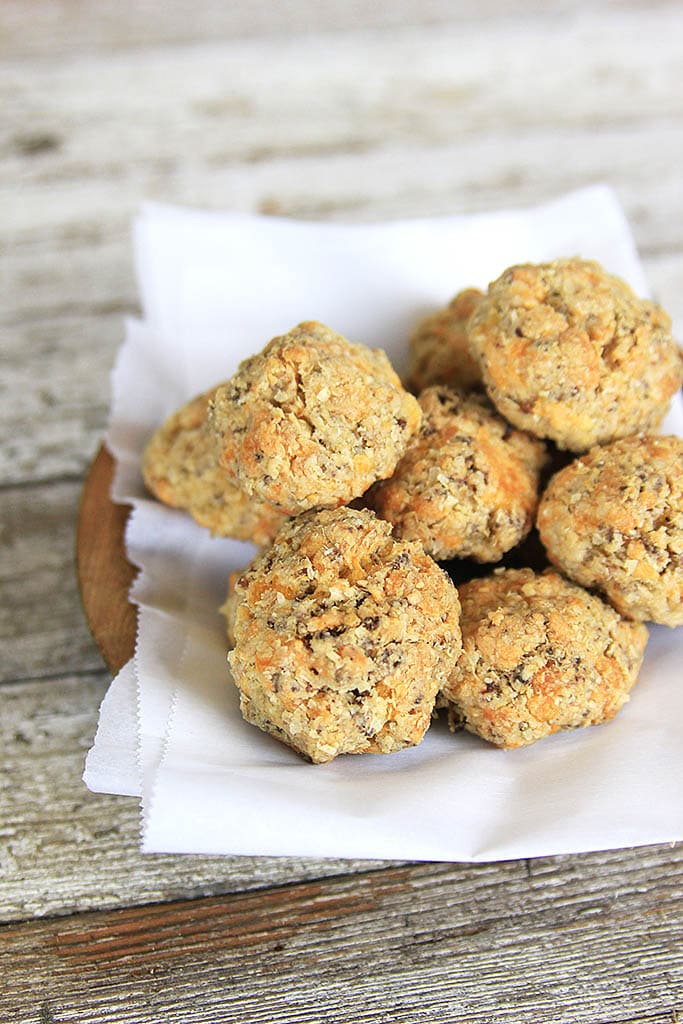 sausage balls in a wooden bowl with parchment paper