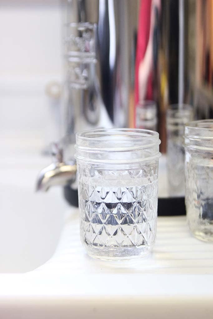 half pint mason jar of clean filtered water