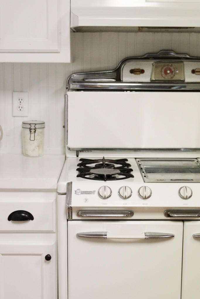 vintage o'keefe and merritt gas stove in a white farmhouse style kitchen
