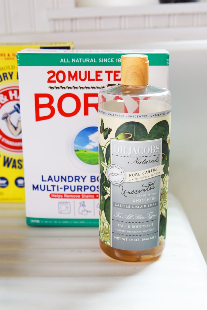 Dr. jacob's castille soap, borax, and washing soda on a vintage farmhouse sink