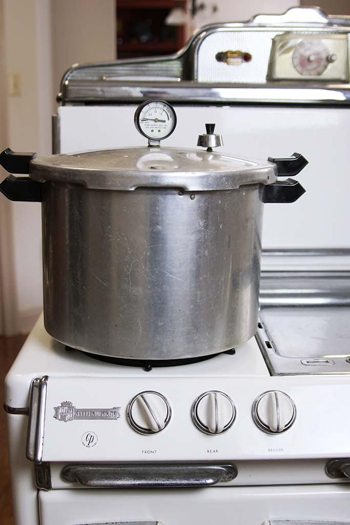 Presto pressure canner sitting on a vintage o'keefe and merrit stove